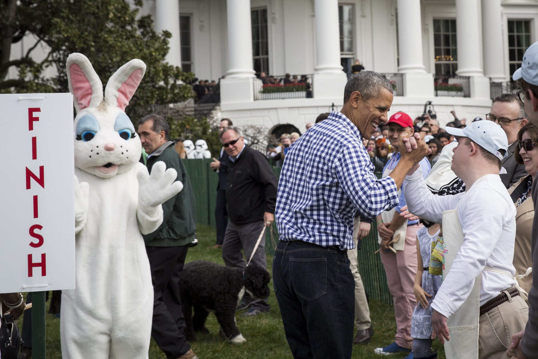 WASHINGTON, DC - MARCH 28: President Barack Obama shakes hands with an attendee during the annual White House Easter Egg Roll on the South Lawn of the White House March 28, 2016 in Washington, DC. The tradition dates back to 1878 when President Rutherford B. Hayes allowed children to roll eggs on the South Lawn. (Photo by Drew Angerer/Getty Images)