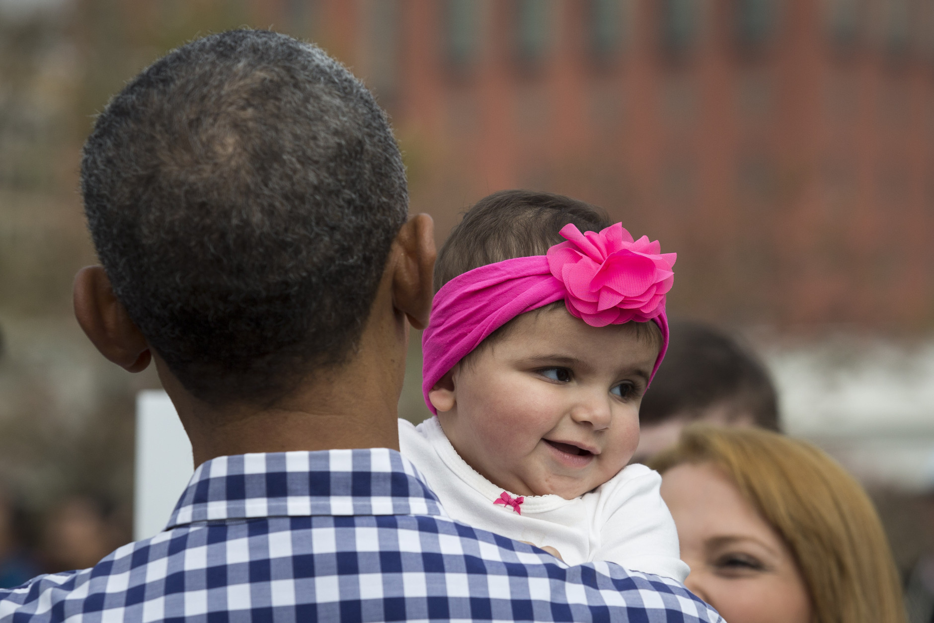WASHINGTON, DC - MARCH 28: President Barack Obama holds Stella Munoz during the annual White House Easter Egg Roll on the South Lawn of the White House March 28, 2016 in Washington, DC. The tradition dates back to 1878 when President Rutherford B. Hayes allowed children to roll eggs on the South Lawn. (Photo by Drew Angerer/Getty Images)