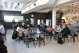 The inside of Union Kitchen's Ivy City location has a communal workspace in addition to plenty of kitchen space. (WTOP/Dana Gooley)
