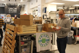 Bright Greens founder Brian Mitchell prepares for an upcoming event in California. (WTOP/Dana Gooley)