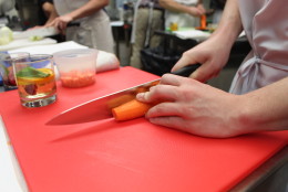 Not everyone takes the chef's advice, but all vegetables were diced without incident. (WTOP/Dana Gooley)