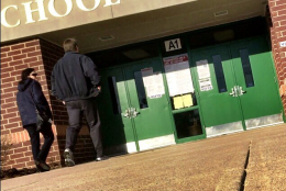 Voters head into a school in Leesburg. (WTOP/Neal Augenstein)