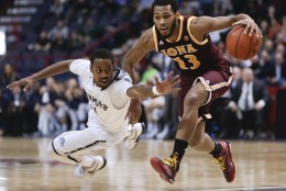 Monmouth guard Je'lon Hornbeak, left, defends against Iona guard Jahaad Proctor (13) during the first half of an NCAA men's college basketball game in the championship of the Metro Atlantic Athletic Conference tournament on Monday, March 7, 2016, in Albany, N.Y. (AP Photo/Mike Groll)