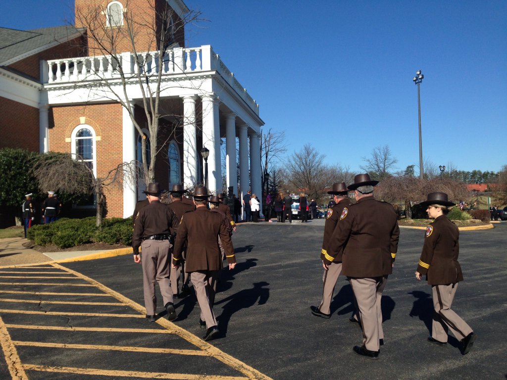 Police officers from all over the area arrive at the funeral of Prince William County Officer Ashley Guindon, March 1, 2016. (WTOP/Jamie Forzato)
