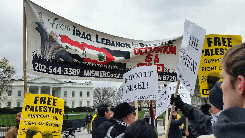 
Participants gather outside the White House for the National March and Rally to Support Palestine, an event coordinated by Al-Awda, The Palestinian Right to Return Coalition and the ANSWER Coalition on Sunday, March 20, 2016. The march was held to coincide with the American Israel Public Affairs Committee conference's opening in D.C. American Israel Public Affairs Committee is regarded as a very powerful pro-Israel lobby. (WTOP/Kathy Stewart)