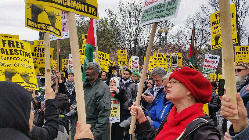 
Participants gather outside the White House for the National March and Rally to Support Palestine, an event coordinated by Al-Awda, The Palestinian Right to Return Coalition and the ANSWER Coalition on Sunday, March 20, 2016. The march was held to coincide with the American Israel Public Affairs Committee conference's opening in D.C. American Israel Public Affairs Committee is regarded as a very powerful pro-Israel lobby. (WTOP/Kathy Stewart)