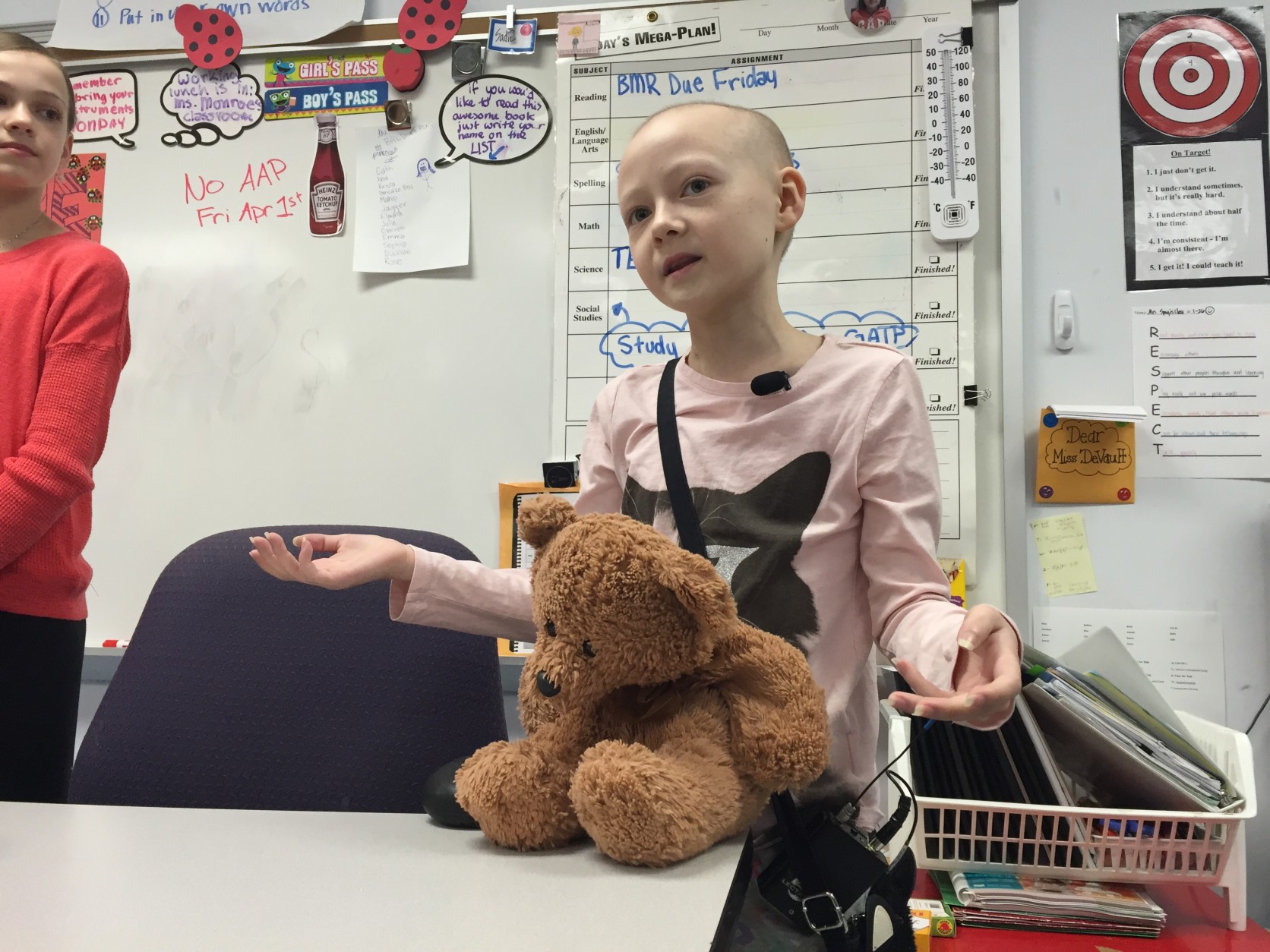 Eleven-year-old Sadie Murata, who's battling a rare form of cancer, returned to class at Laurel Ridge Elementary for the first time in months Tuesday. She was there to encourage fellow students to make bucket lists of short and long term goals. (WTOP/Michelle Basch)