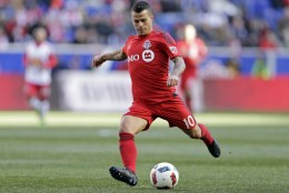Toronto FC forward Sebastian Giovinco (10) takes a shot against the New York Red Bulls during the second half of an MLS soccer game Sunday, March 6, 2016, in Harrison, N.J. Toronto FC defeated the Red Bulls 2-0. (AP Photo/Adam Hunger)