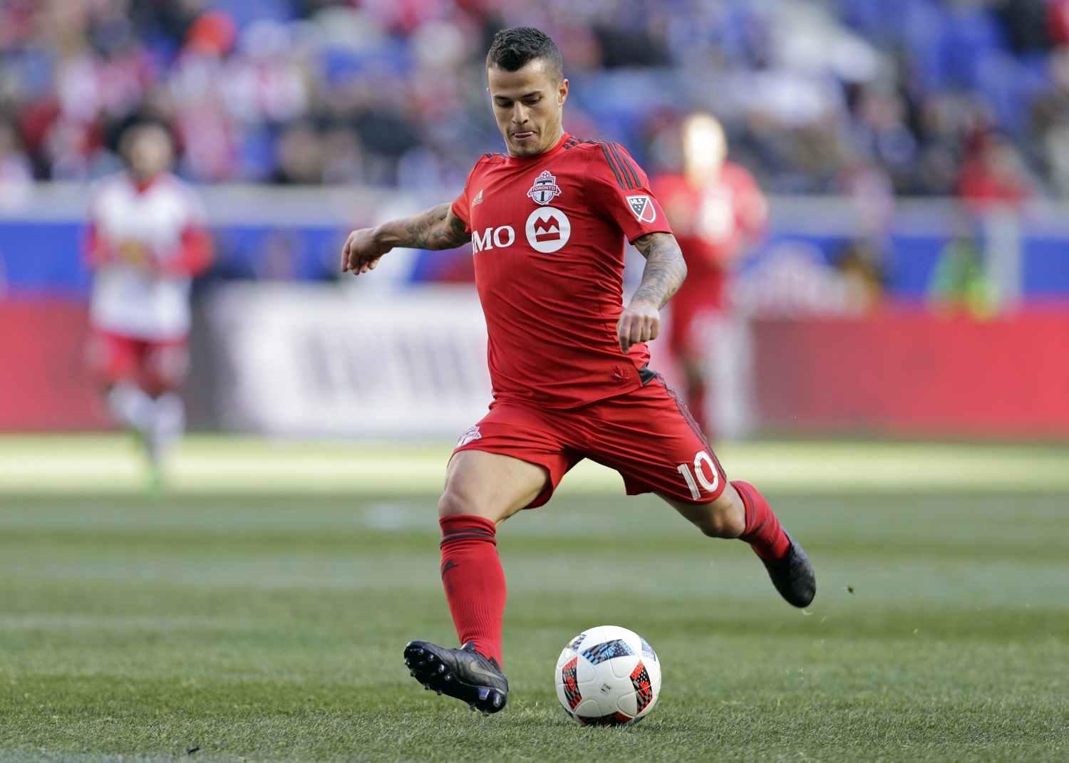 Toronto FC forward Sebastian Giovinco (10) takes a shot against the New York Red Bulls during the second half of an MLS soccer game Sunday, March 6, 2016, in Harrison, N.J. Toronto FC defeated the Red Bulls 2-0. (AP Photo/Adam Hunger)