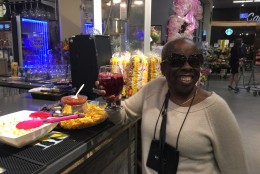 Enjoying sangria, Shirley Gaskin prefers to drink at the bar with her foot on the rail,  her elbow on the table and with easy access to snacks. She did her grocery shopping the day before. (WTOP/Kristi King)