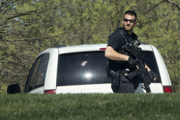 A Secret Service Police Officer patrols the North Lawn of the White House in Washington, Monday, March 28, 2016, after reports of an active shooter at the U.S. Capitol. A U.S. Capitol Police officer was shot and injured Monday, March 28, 2016,  at the Capitol Complex. The officer was not seriously injured and the shooter was caught and is in custody, Capitol officials said.  (AP Photo/Jacquelyn Martin)