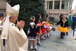 Archbishop of Washington, Cardinal Donald Wuerl applauds and thanks members of the O’Neill James School of Irish Dance, located in Arlington. (WTOP/Kristi King)