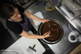 photo of Jennifer Costa stirring Valrhona chocolate