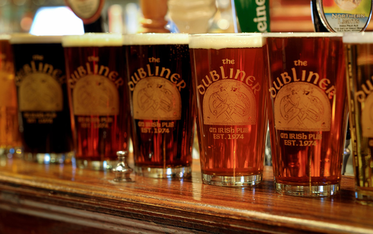 Glasses of beer lined up at the bar at The Dubliner. (Courtesy The Dubliner)