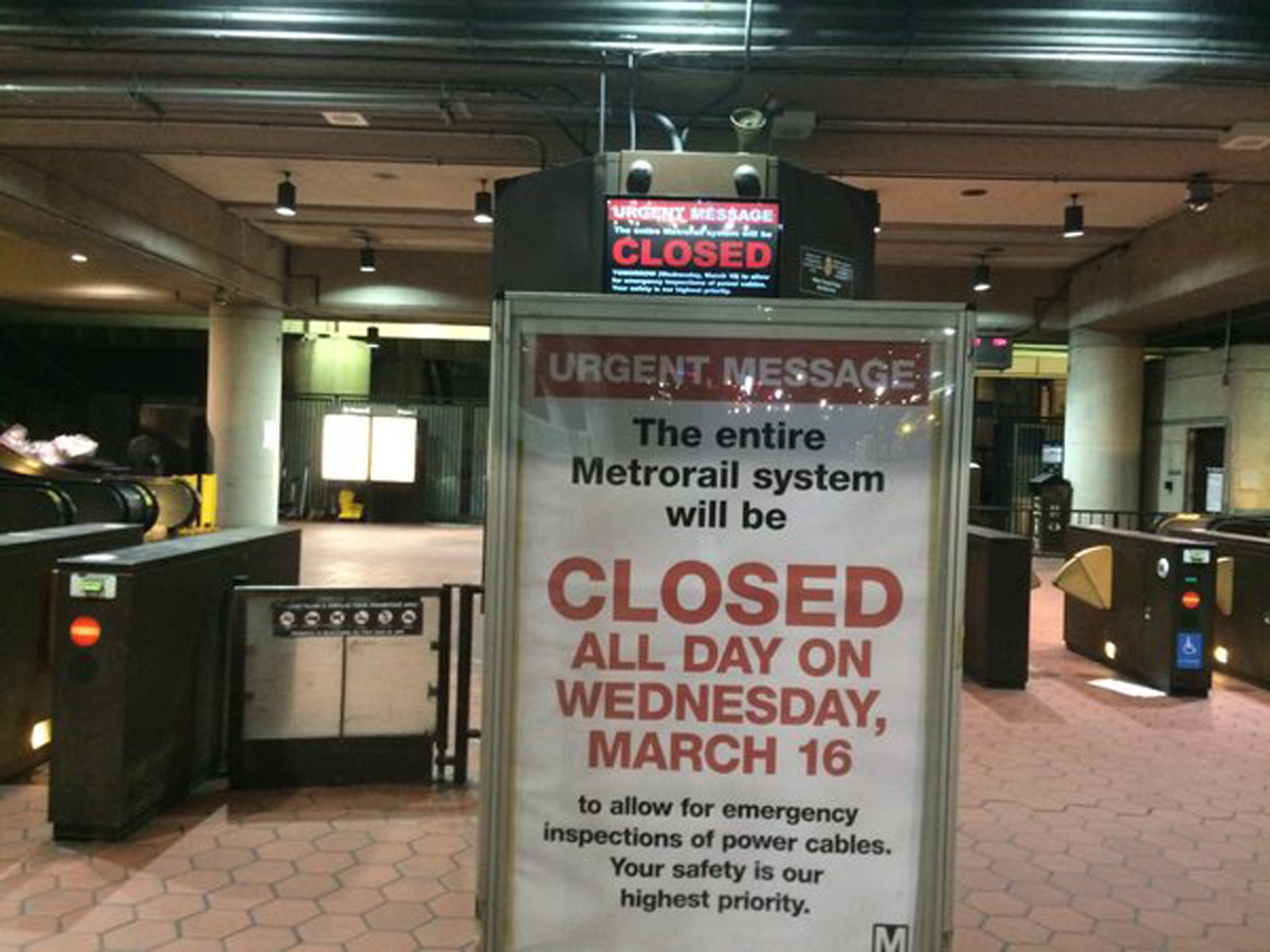 A sign alerting commuters that Washington's Metro subway system will be shutdown for a full day. (WTOP/Nick Iannelli)