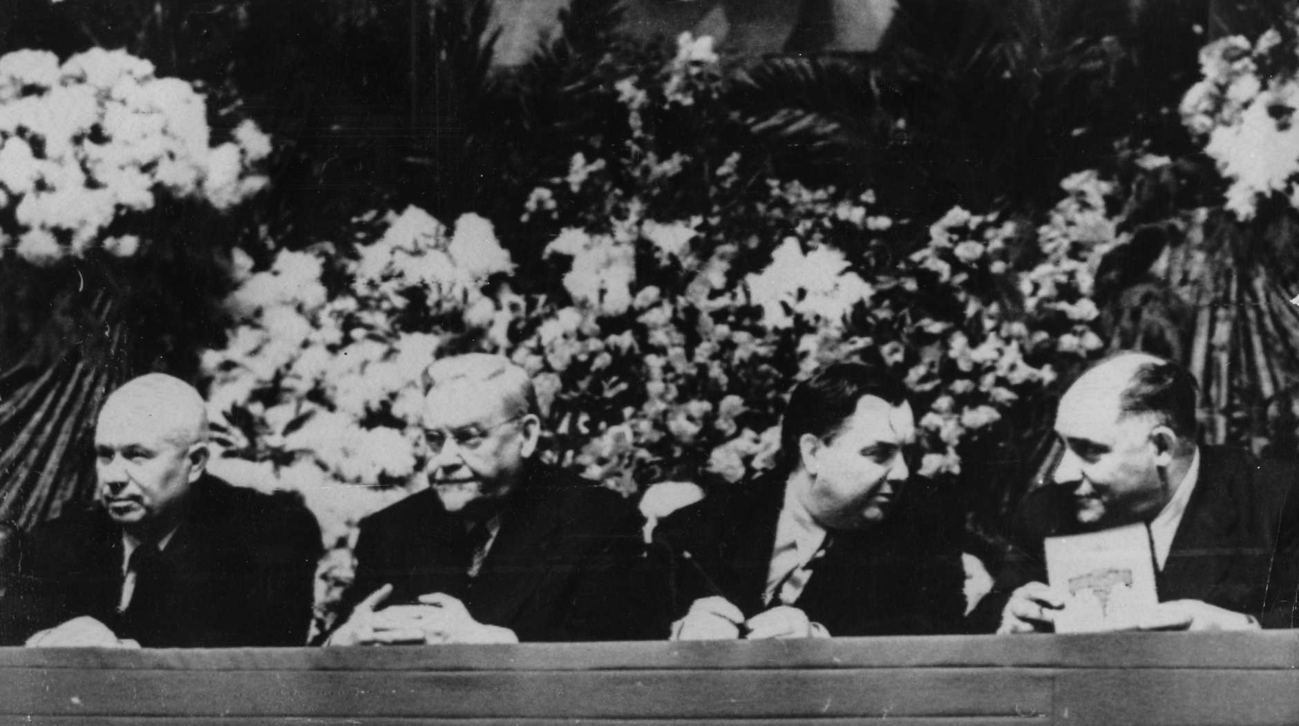 Soviet politicians Nikita Khrushchev, Nikolai Bulganin, Georgy Maximilianovich Malenkov and Lazar Kaganovitch, from left to right, show their presence framed by flowers at a construction workers mass demonstration in Moscow, Russia, February 4, 1957. (AP Photo)