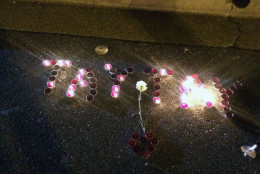 Davonte Washington's nickname "Tay Tay" in votive candles. (WTOP/Dick Uliano)