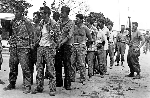 (FILES): This April 1961 file photo shows a group of Cuban counter-revolutionaries, members of Assault Brigade 2506, after their capture in the Bay of Pigs, Cuba.  For the first time in 40 years, the players in the failed US-sponsored Bay of Pigs invasion of Cuba sat down face-to-face 22 March 2001 to try to shed more light on one of the bitterest confrontations of the Cold War, which still strains US-Cuban ties. The conference was attended by President Fidel Castro, Cuban and US academics, plus a handful of Cuban exiles from Assault Brigade 2506, which carried out the attack. Hundreds of declassified Cuban documents were released on the first day of the three-day conference.   AFP PHOTO/FILES/PL/MIGUEL VINAS        (Photo credit should read MIGUEL VINAS/AFP/Getty Images)