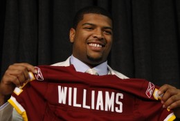 Washington Redskins first-round draft pick Trent Williams holds up a jersey during an NFL football news conference at Redskins Park, Friday, April 23, 2010, in Ashburn, Va.(AP Photo/Luis M. Alvarez)