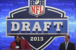 Former Washington Redskins linebacker LaVar Arrington is joined by NFL commissioner Roger Goodell as he announces a draft pick during the second round of the NFL Draft, Friday, April 26, 2013 at Radio City Music Hall in New York.  (AP Photo/Mary Altaffer)