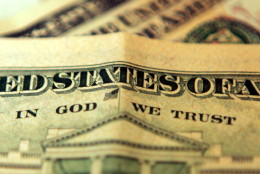 LONDON, UNITED KINGDOM - OCTOBER 23: In this photo illustration the phrase "In God We Trust"  can be seen on an American ten dollar bill on October 23, 2008 in London, England. The British pound has hit it's lowest point against the Dollar in five years as it fell to just above 1.62 US Dollars after fears of a recession were acknowledged by the government and financial experts today.  (Photo by Hugh Pinney/Getty Images)