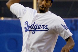 Los Angeles Lakers' Kobe Bryant throws out the first pitch at Dodgers Stadium prior to the start of the game between the Los Angeles Dodgers and the San Diego Padres Tuesday, June 27, 2000, in Los Angeles. (AP Photo/Kevork Djansezian)