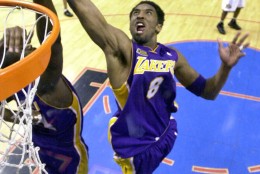 Los Angeles Lakers' Kobe Bryant goes up for a rebound in the fourth quarter against the Philadelphia 76ers' in game 5  of the NBA finals Friday June 15, 2001 in Philadelphia.  The Lakers won their second straight NBA championship, defeating the 76ers 108-96 to clinch the best-of-seven series 4-1.(AP Photo/Mark J. Terrill,  Pool)