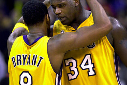FILE-This April 21, 2002 file photo shows Los Angeles Lakers's Kobe Bryant, left, and Shaquille O'Neal embracing in the closing minutes in Game 1 of their best-of-five first-round Western Conference playoff series against the Portland Trail Blazers in Los Angeles.  O'Neal says on Twitter  Wednesday June 1, 2011,that he's "about to retire." O'Neal sent a Tweet shortly before 2:45 p.m. saying, "im retiring." It included a link to a 16-second video in which he says, "We did it; 19 years, baby. Thank you very much. That's why I'm telling you first: I'm about to retire. Love you. Talk to you soon." (AP Photo/Mark J. Terrill,File)