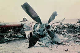 The burned out wreckage of a U.S. aircraft lies in the desert some 300 miles south of Tehran after the abortive commando-style raid into Iran, April 1980, aimed at freeing the American hostages being held in Tehran.  The rescue mission fell apart when several helicopters failed and a helicopter and C141 transport plane collided.  At least 8 U.S. servicemen died in the mission.  (AP Photo)