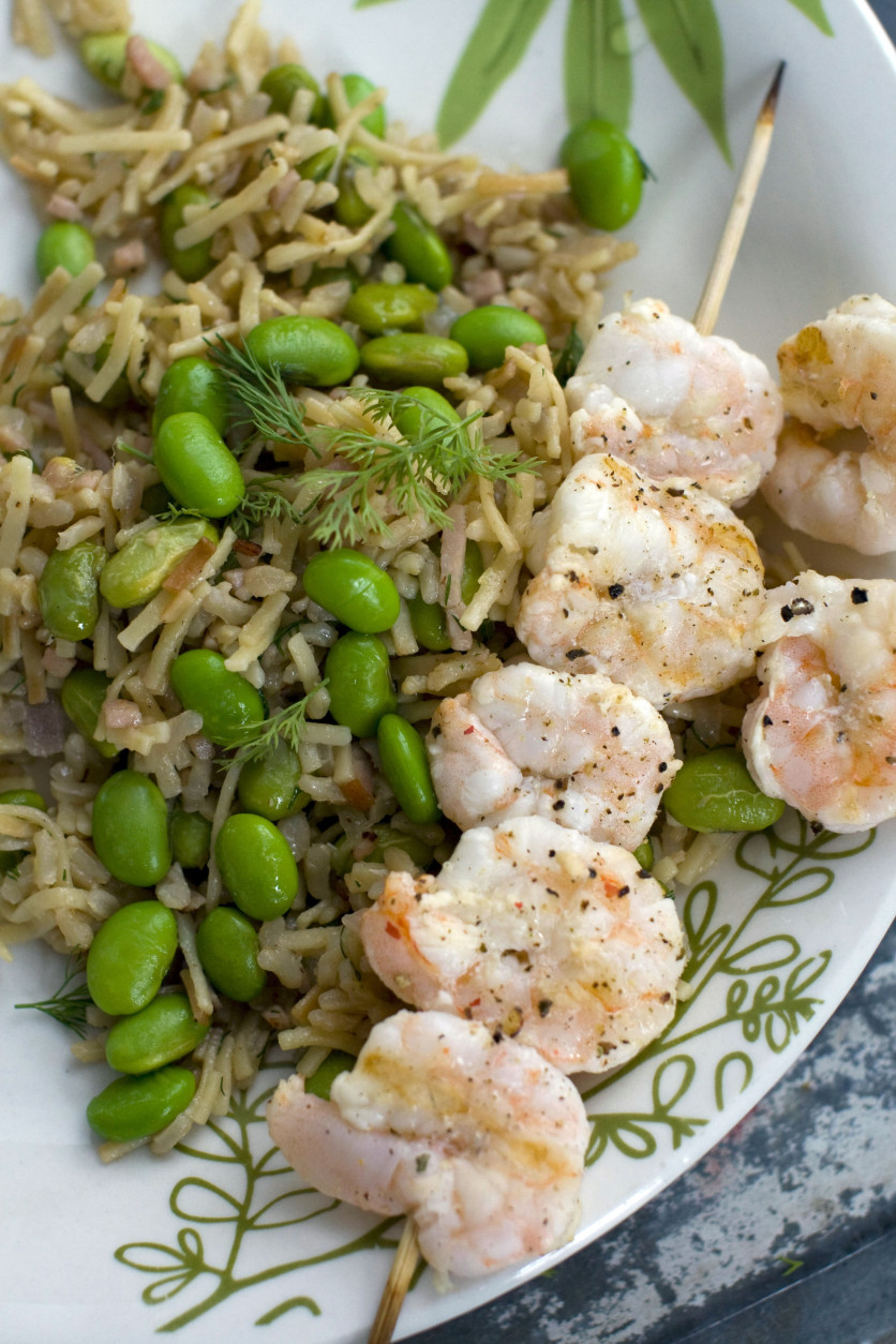 This April 25, 2011 photo shows rice and noodle pilaf with edamame and grilled shrimp in Concord, N.H. This recipe is a one-pot meal that can be on the table in around 35 minutes.    (AP Photo/Matthew Mead)