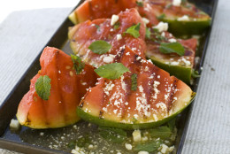 This Aug. 22, 2011 photo shows grilled watermelon salad in Concord, N.H. When ready to serve, place grilled watermelon pieces on a large platter or divide among individual plates.  (AP Photo/Matthew Mead)