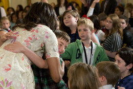 First lady Michelle Obama gives hugs to children at the annual White House Take Our Daughters and Sons to Work Day event attended by the children of Executive Office employees, young people from Big Brothers Big Sisters of America, SchoolTalk, and the D.C. Child and Family Services Agency, in the East Room of the White House in Washington, Wednesday, April 20, 2016. (AP Photo/Jacquelyn Martin)f