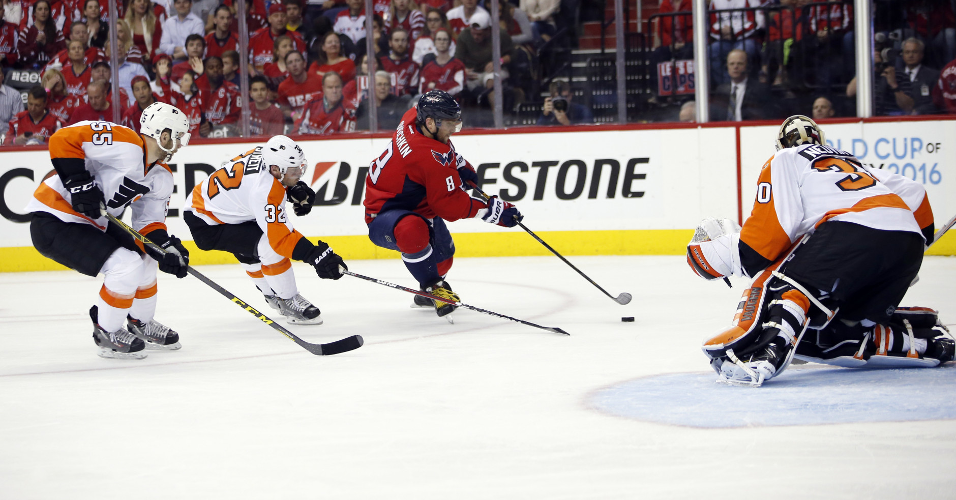 Washington Capitals left wing Alex Ovechkin (8), from Russia, prepares a shot that was then stopped by Philadelphia Flyers goalie Michal Neuvirth (30), from the Czech Republic, during the second period of Game 5 in the first round of the NHL Stanley Cup hockey playoffs, Friday, April 22, 2016, in Washington. (AP Photo/Alex Brandon)