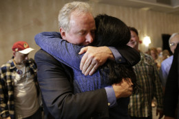 Democratic U.S. Senate candidate, Rep. Chris Van Hollen, D-Md., left, embraces supporter Carole Price after an election night party in Bethesda, Md., Tuesday, April 26, 2016. Van Hollen defeated Rep. Donna Edwards, D-Md., in the Democratic primary for U.S. Senate. (AP Photo/Patrick Semansky)