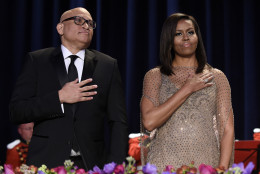 Larry Wilmore, left, guest host from Comedy Central, center, and first lady Michelle Obama, right, listen to the National Anthem at the annual White House Correspondents' Association dinner at the Washington Hilton in Washington, Saturday, April 30, 2016. (AP Photo/Susan Walsh)