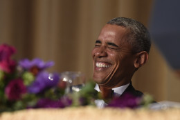 President Barack Obama laughs as he listens to Larry Wilmore, the guest host from Comedy Central, speak at the annual White House Correspondents' Association dinner at the Washington Hilton in Washington, Saturday, April 30, 2016. (AP Photo/Susan Walsh)