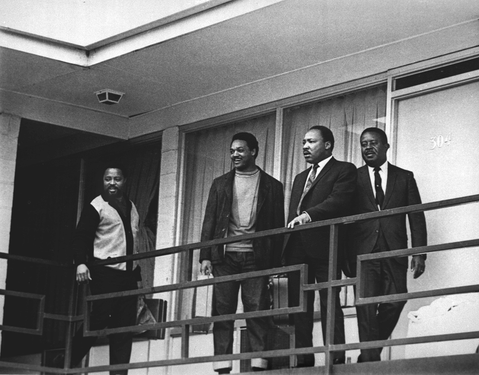 FILE - In this April 3, 1968 file photo, the Rev. Martin Luther King Jr. stands with other civil rights leaders on the balcony of the Lorraine Motel in Memphis, Tenn., a day before he was assassinated at approximately the same place. From left are Hosea Williams, Jesse Jackson, King, and Ralph Abernathy. King is one of America's most famous victims of gun violence. Just as guns were a complicated issue for King in his lifetime, they loom large over the 30th anniversary of the holiday honoring his birthday. (AP Photo, File)
