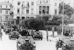 After Greece surrendered to the invading Nazi troops, armored military vehicles of the victorious German army parade past Fieldmarshal General Wilhelm List, in Athens, on May 3, 1941. (AP Photo)