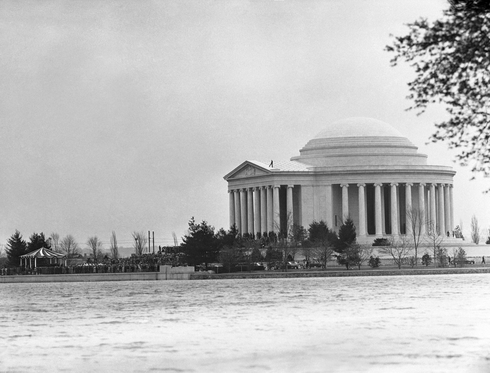 Jefferson Memorial dedication ceremonies, April 13, 1943, looking across the tidal basin in Washington.  Man standing on top of the memorial is a guard. (AP Photo/Gene Abbott)