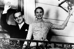 Prince Rainier III and actress Princess Grace Kelly wave from the palace terrace at Monaco in the South of France on April 18, 1956. The couple is hosting a garden party for the people of Monaco on the palace grounds after being married in a civil ceremony at the palace a few hours earlier. (AP Photo)