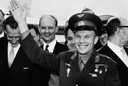 Soviet spaceman Yuri Gagarin waves after he arrived at the London Airport, July 1, 19611 for a private visit as the guest of the Russian Trade fair. The welcoming committee was headed by a virtually unknown civil servant, secretary to Lord Hailsham's Science Ministry. Several newspapers criticized the Government for not giving Gararin a real hero's welcome even though he came on a private visit. (AP Photo)