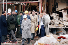 U.S. ambassador to Bonn, Richard Burt, (4th from left) and Berlin Governing mayor Eberhard Diepgen (next to him with helmet) inspect the remains of the discotheque La Bell, Saturday, April 5, 1986. The discotheque, which is mainly visited by American soldiers, was the site of a heavy bomb explosion last night. Two people were killed in the blast and more than 100 injured. (AP Photo/Klostermaier)
