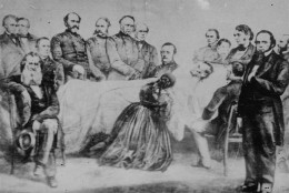 The death bed scene after President Abraham Lincoln was mortally wounded in Ford's Theater April 14, 1865, is shown in this rare picture.  The picture shows Mrs. Lincoln kneeling beside the bed and members of the cabinet behind it.  This picture was supposed to have been given to a friend by Mrs. Lincoln shortly after the funeral and then passed down through the family from generation to generation.  (AP Photo)