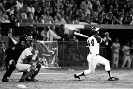 Atlanta Braves' Hank Aaron (44) breaks Babe Ruth's record for career home runs as he hits his 715th off Los Angeles Dodgers pitcher Al Downing in the fourth inning of the game opener at Atlanta-Fulton County Stadium, Ga., Monday night, April 8, 1974.  (AP Photo)