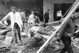 Rescue workers are shown carrying the body of a victim of the bomb blast at the American Embassy in Beirut, Lebanon, on April 18, 1983. The entire front of the seven-story building collapsed. (AP Photo/Jamal)
