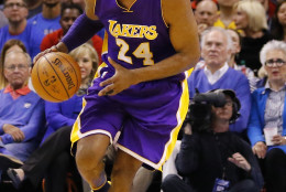 Los Angeles Lakers forward Kobe Bryant (24) drives down the court against the Oklahoma City Thunder during the first half of an NBA basketball game in Oklahoma City, Monday, April 11, 2016. (AP Photo/Alonzo Adams)