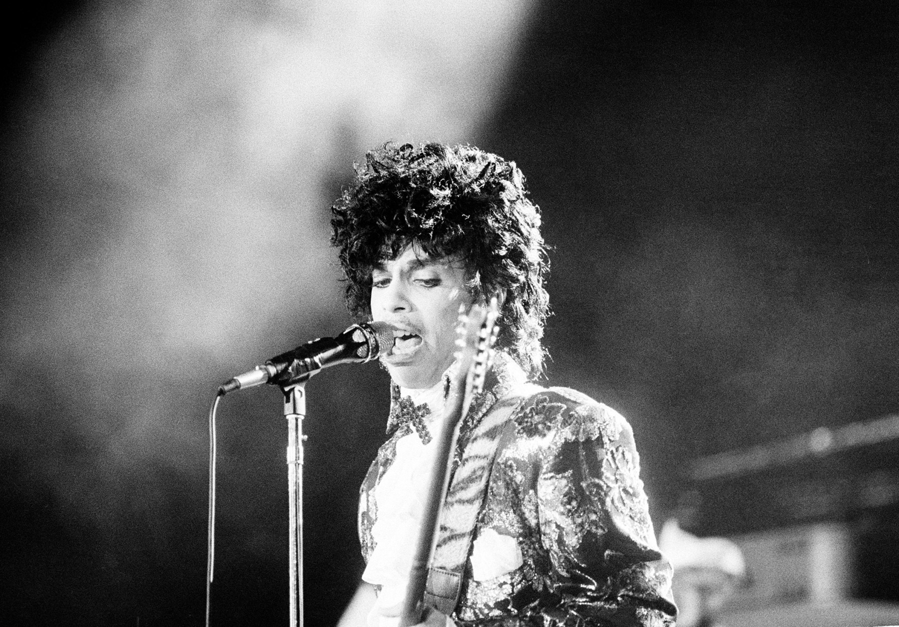 Rock singer Prince performs at the Orange Bowl during his Purple Rain tour in Miami, Fla., April 7, 1985.  (AP Photo/Phil Sandlin)