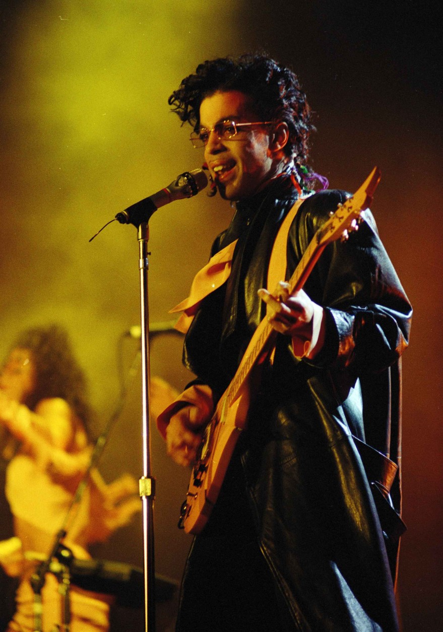 U.S. rock star &quot;Prince&quot; performs on the stage of the Paris Bercy Stadium in front of thousands of fans, Sunday evbening, June 14, 1987. (AP Photo/Olivier Boitet)