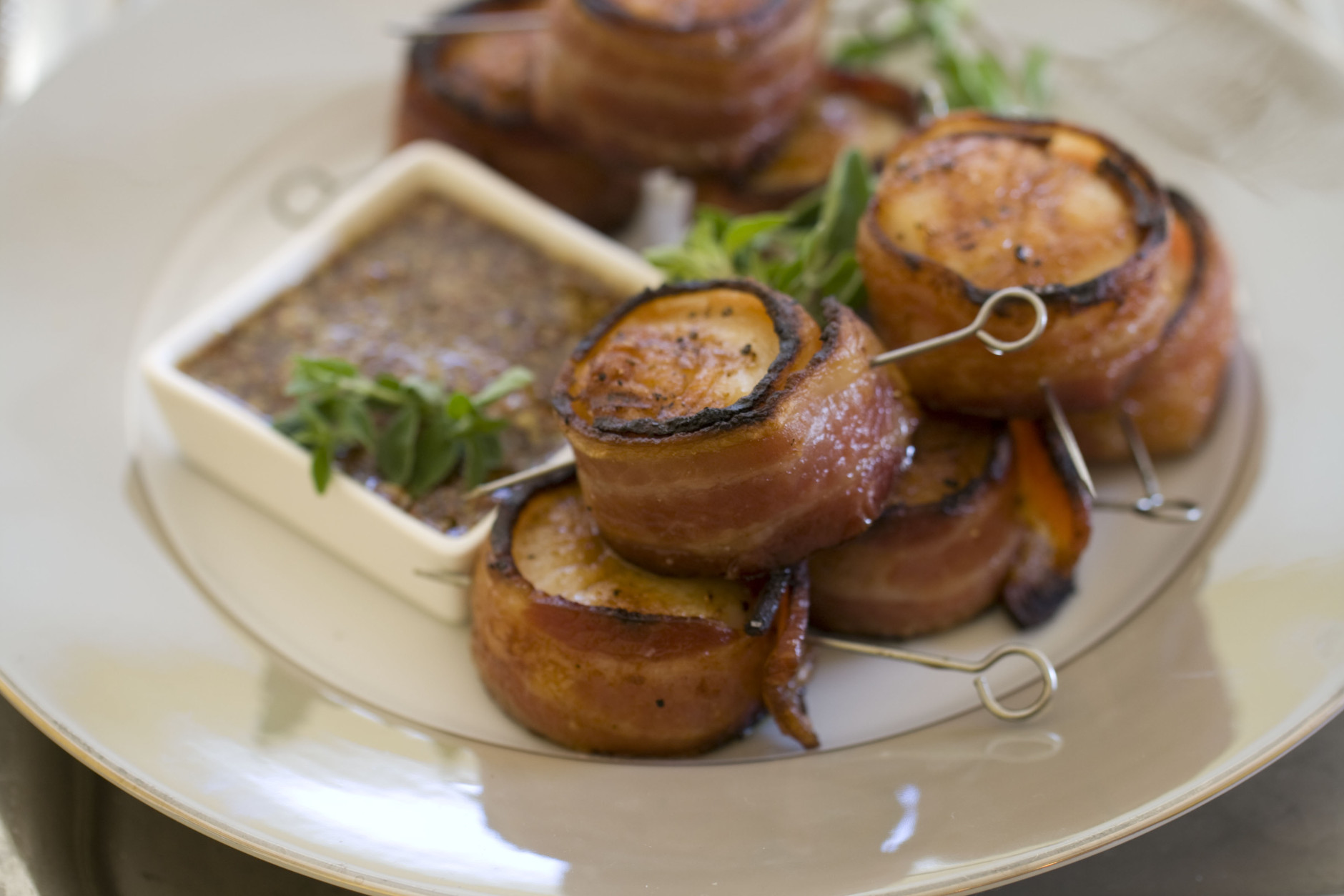 This Nov 4, 2013 photo shows grilled bacon wrapped scallops in Concord, N.H. This all-protein finger food appetizer is perfect for holiday entertaining. (AP Photo/Matthew Mead)