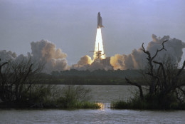 The Space Shuttle orbiter Discovery lifts off from Launch Pad 398 in Kennedy Space Center at morning on Tuesday, April 24, 1990, carrying a crew of five and the Hubble Space Telescope. The mission, STS-31, had been originally scheduled for launch on April 10th but was scrubbed because of a faulty APU. NASA officials and scientist around the world are looking forward to the first glimpse into space by the telescope. (AP Photo/Paul Kizzle)